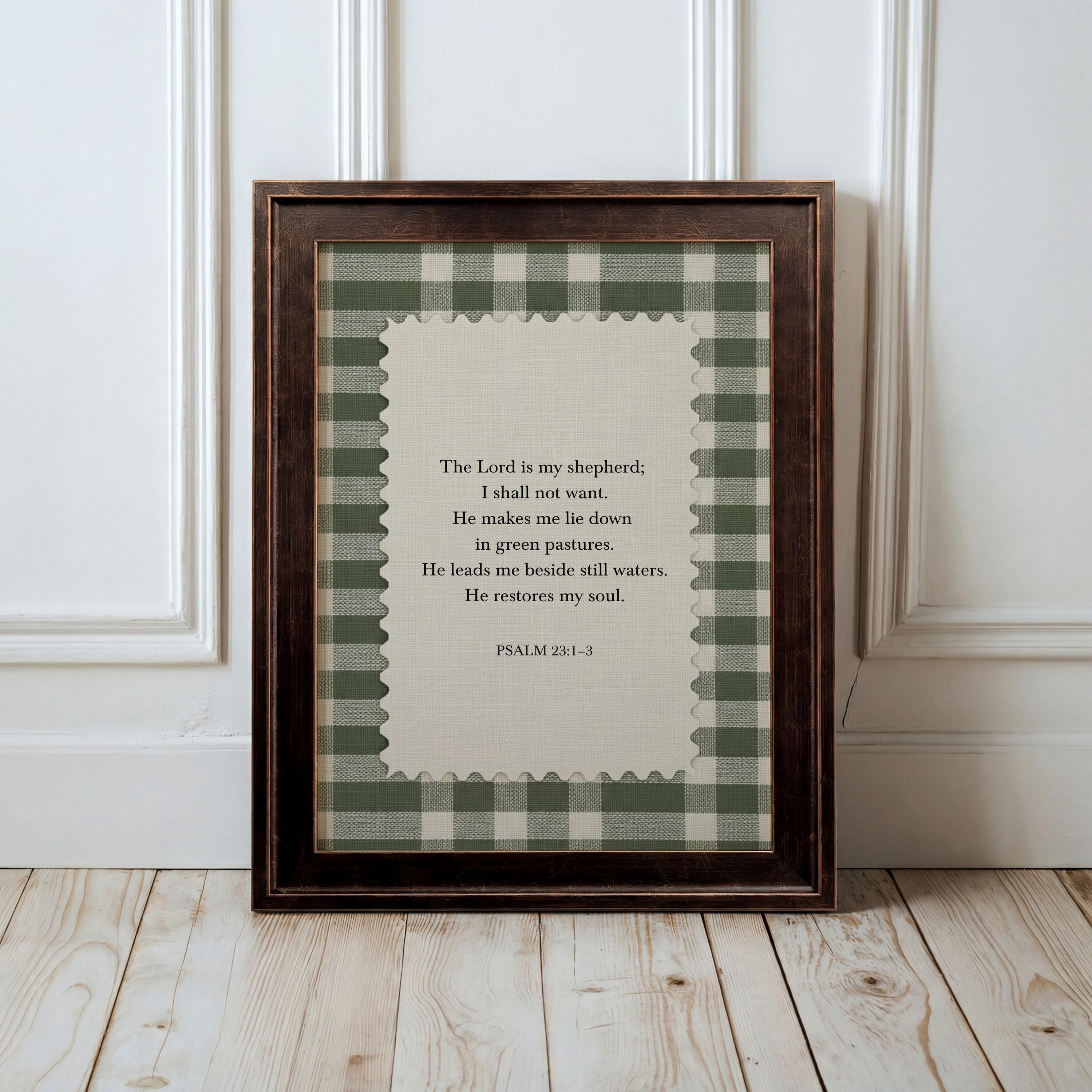 A framed print of a Bible verse from Psalm 3:1-3 is displayed on a wooden floor against a white wall.