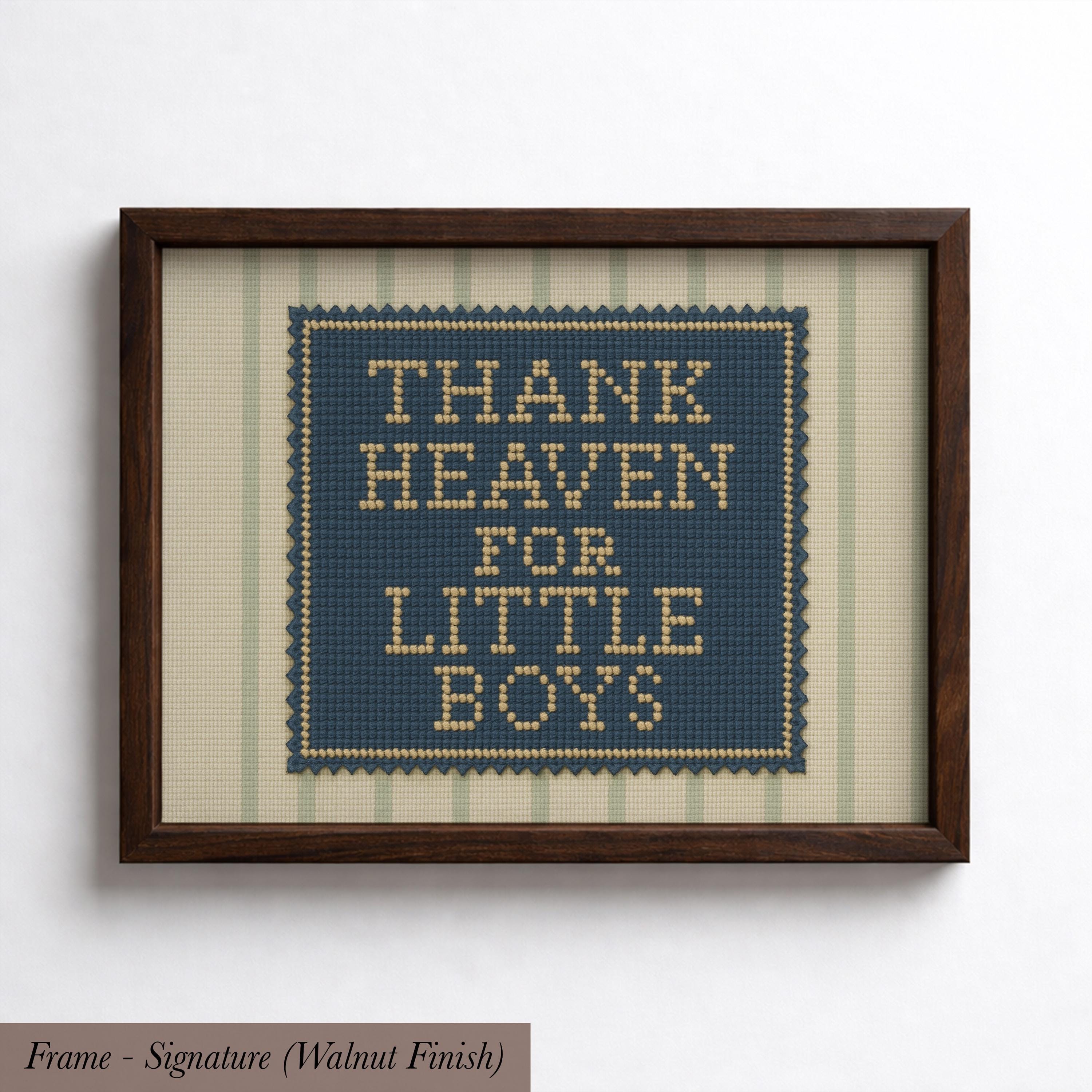 The image is a framed print with a cross-stitch design that says "THANK HEAVEN FOR LITTLE BOYS".