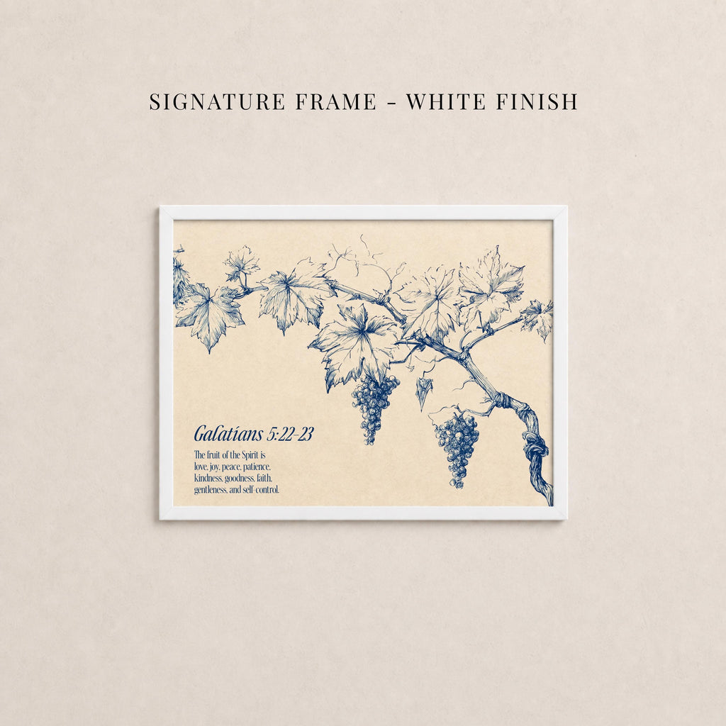 The image is a framed print featuring a blue illustration of a vine with grapes on a branch.