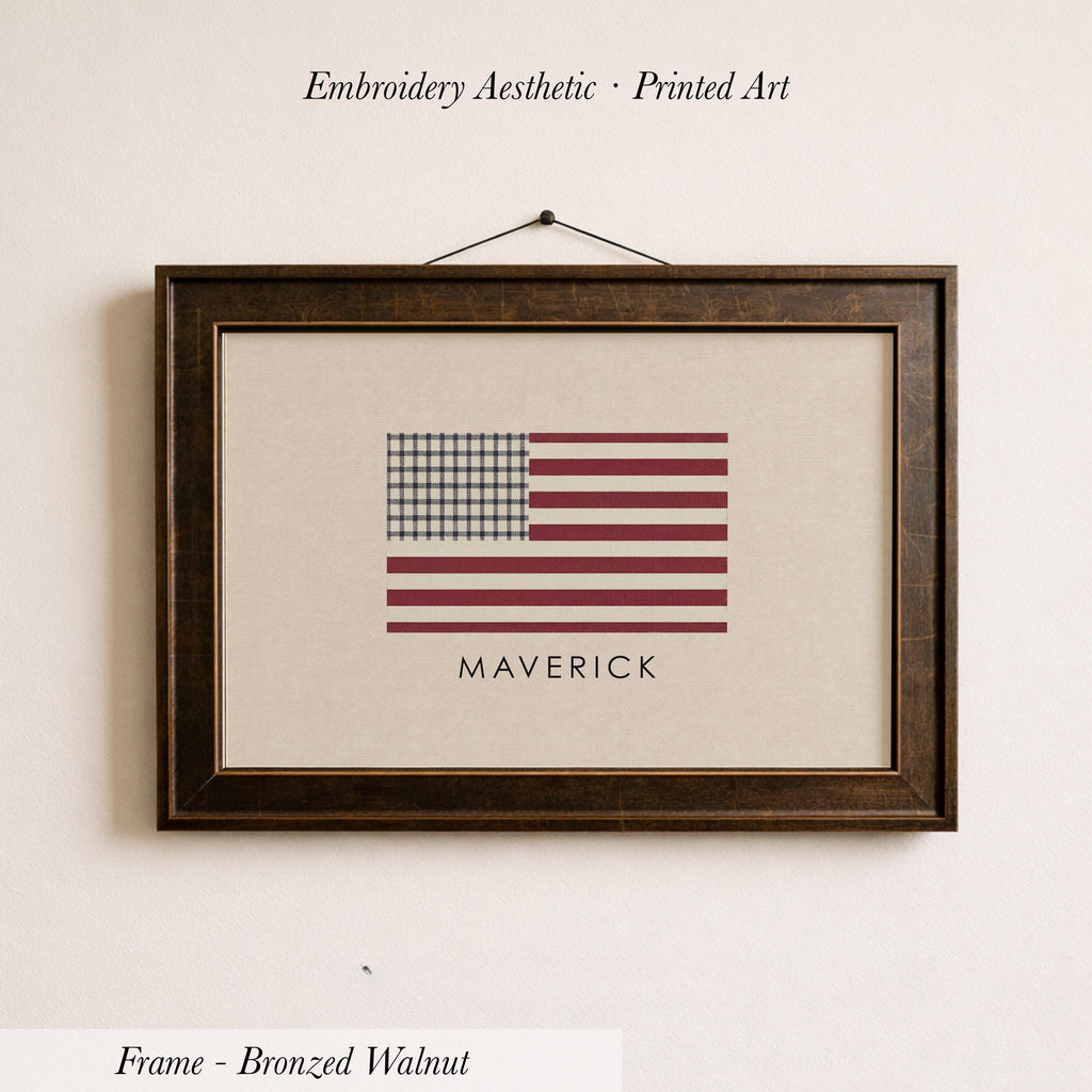 a framed print of the American flag with the name "MAVERICK" printed below it.
