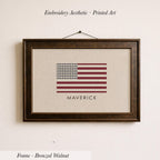 a framed print of the American flag with the name "MAVERICK" printed below it.