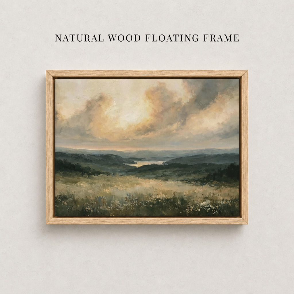 The image is a painting of a natural landscape, featuring a field with trees and mountains in the background. The painting is framed in a natural wood floating frame, which complements the overall aesthetic of the artwork.