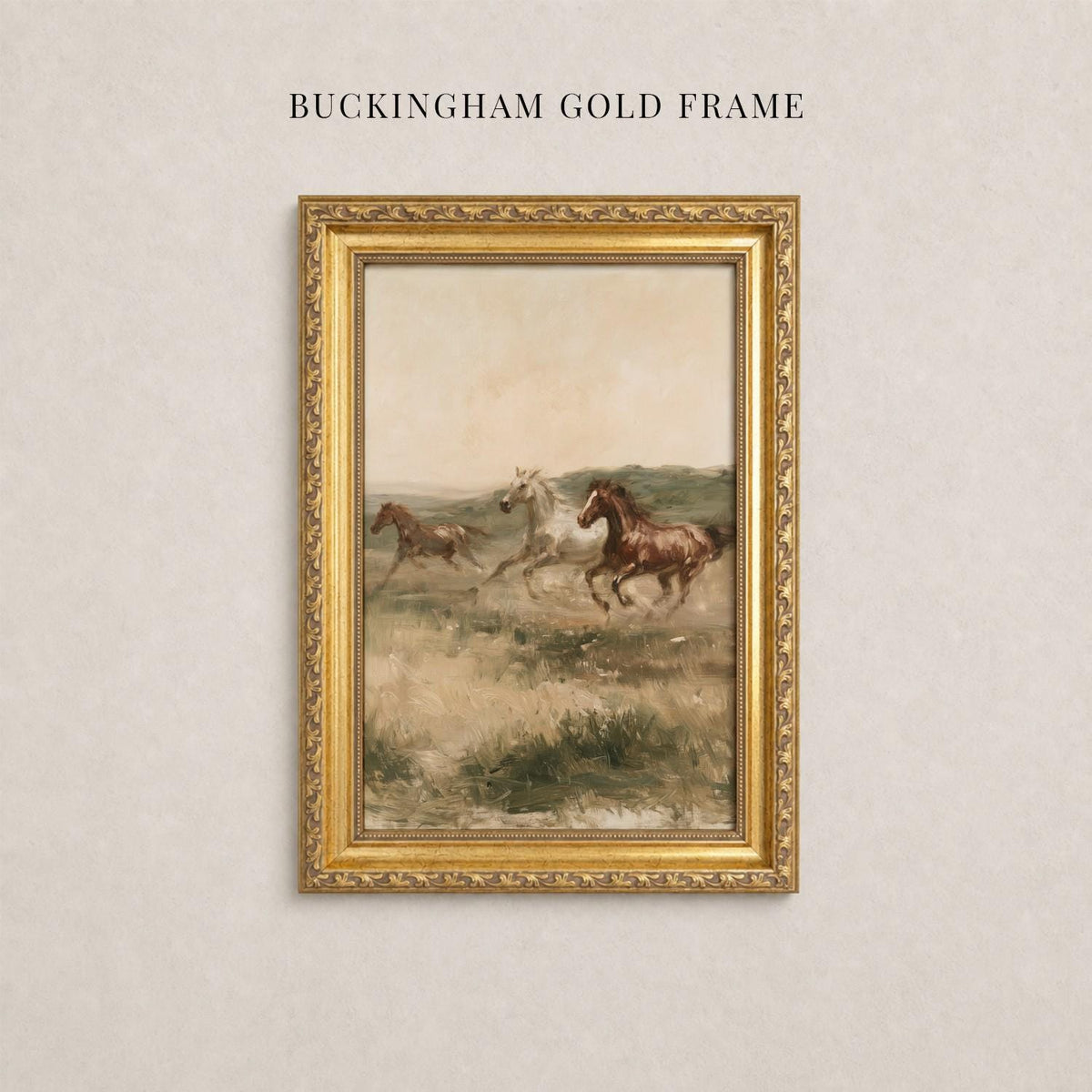 A painting of three horses galloping across a grassy field, framed in a gold frame.