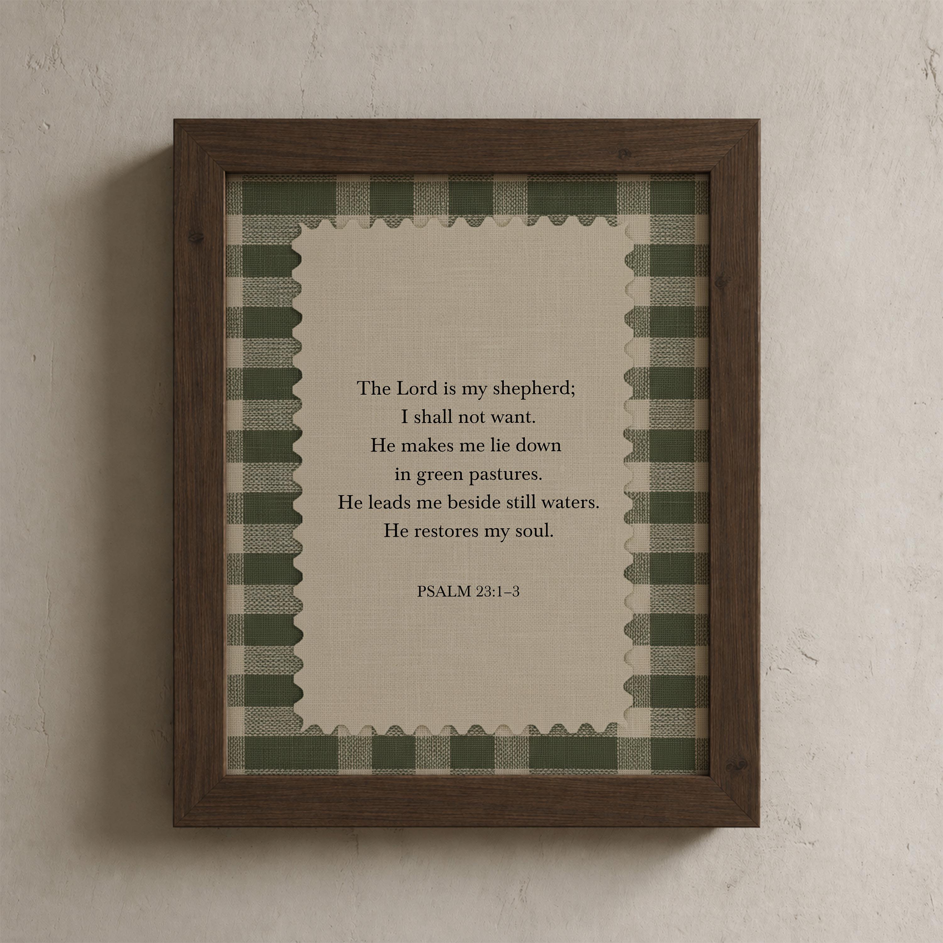 a framed print with a religious text, specifically a verse from the Bible, in a wooden frame with a green and white checkered border.