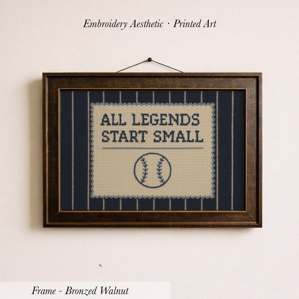a framed embroidered design with the text "ALL LEGENDS START SMALL" and a baseball graphic.