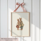 A framed illustration of two rabbits, one wearing a striped shirt and the other a pink dress, standing together and appearing to be in a loving embrace.