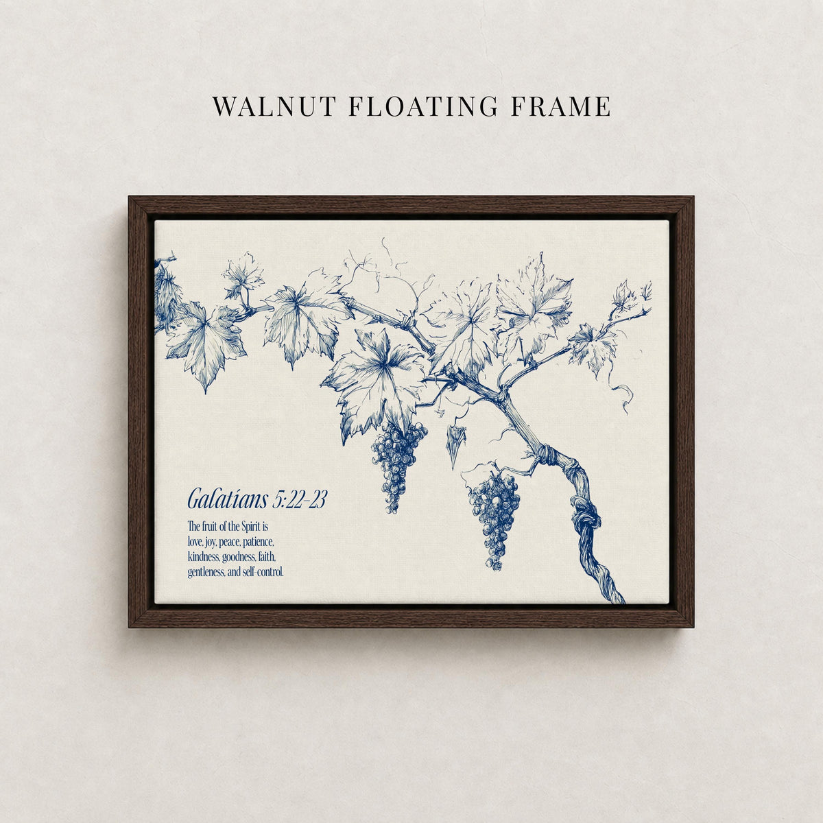 The image is a framed print featuring a detailed illustration of a grape vine with grapes hanging from it. The text below the illustration provides a biblical reference, specifically Galatians 5:22-23, which translates to "The joy of the spirit is love, patience, kindness, good-heartedness, gentleness, and self-control."