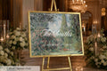 a large framed sign displaying the name "The Smiths" and the date "September 12th, 2016" in a formal setting with floral arrangements and candles.