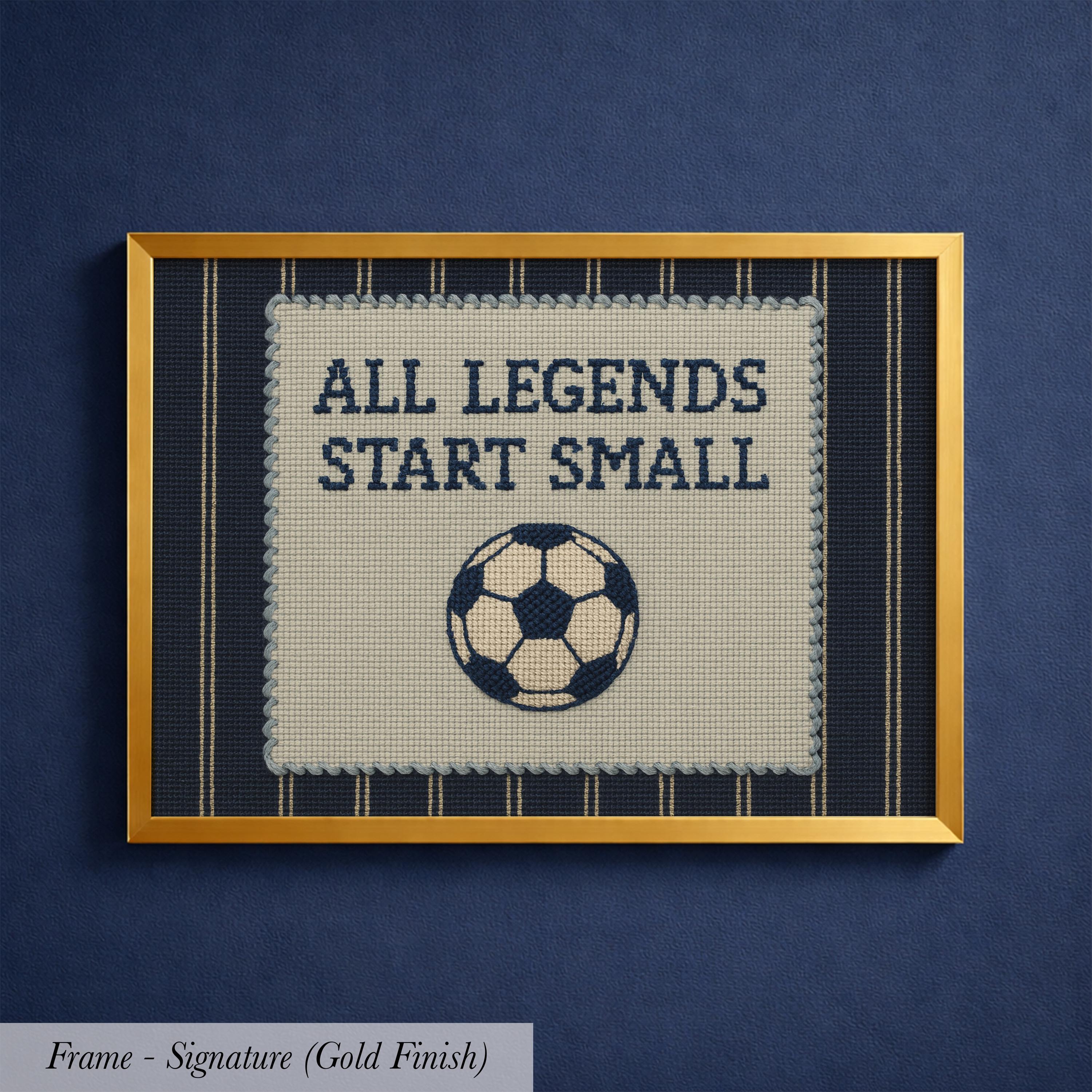 a framed embroidered design with the text "ALL LEGENDS START SMALL" and a soccer ball.