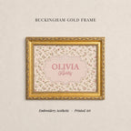 The image is a gold-framed embroidered picture of a person named Olivia, with the text "Buckingham Gold Frame" above it.