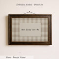 The image is a framed print with the text "How Lucky Are We" displayed on it.
