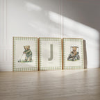 three framed pictures of teddy bears, each depicting a different scene.