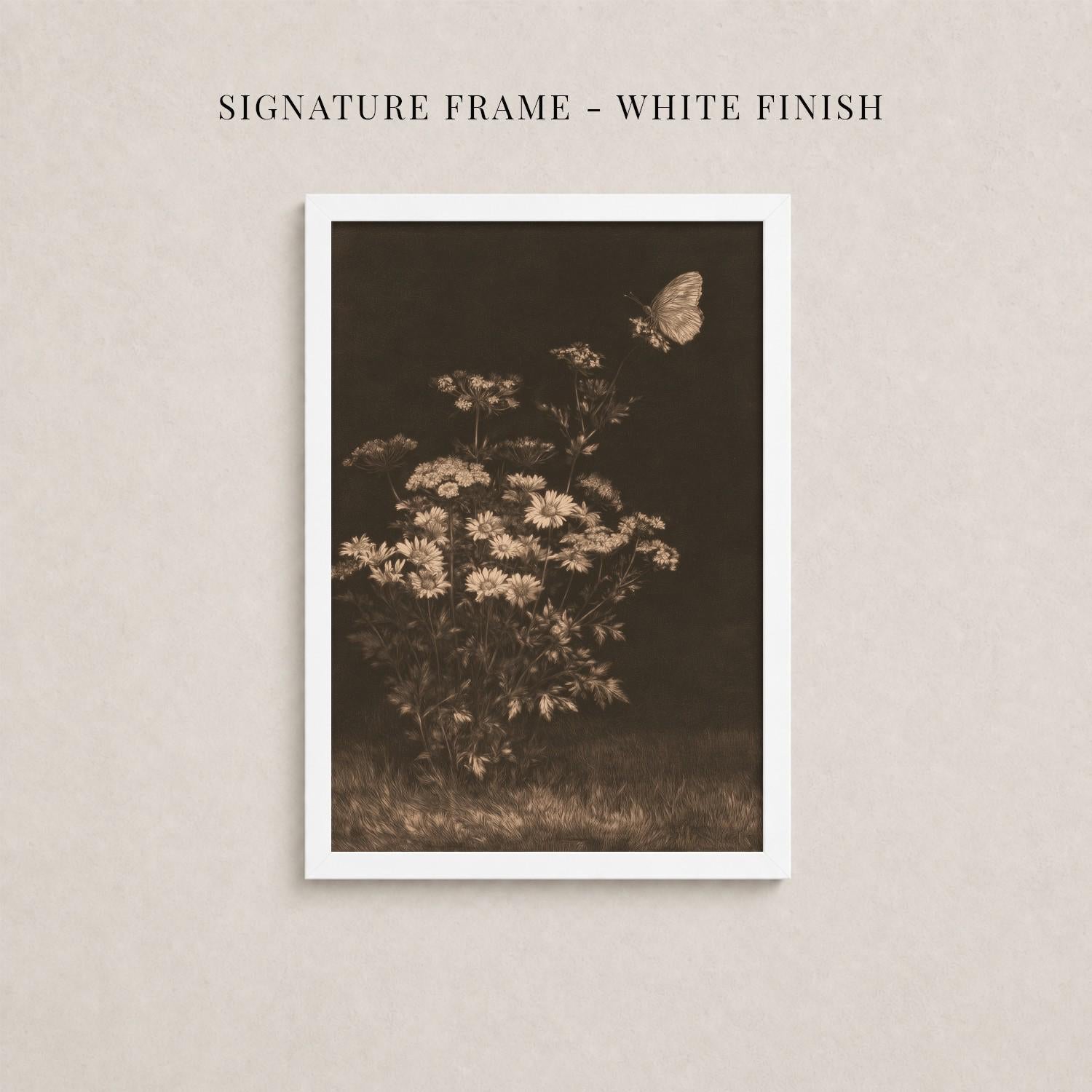 The image is a framed photograph of a flower arrangement with a butterfly in flight.