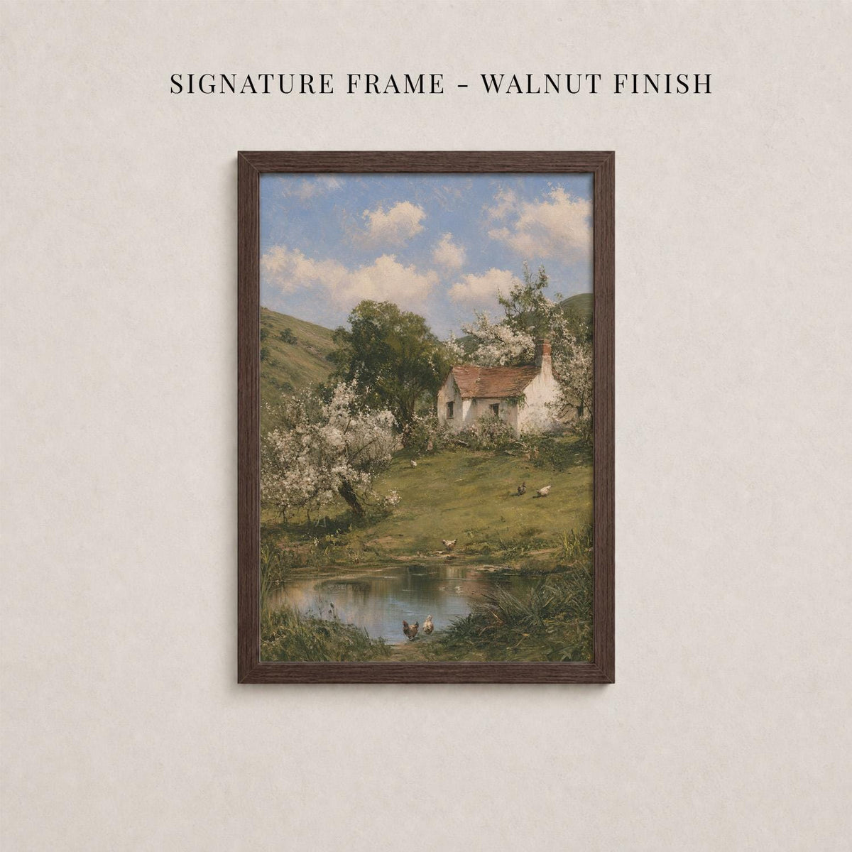 The image is a framed painting depicting a rural landscape with a small white house, a pond, and trees with white flowers.