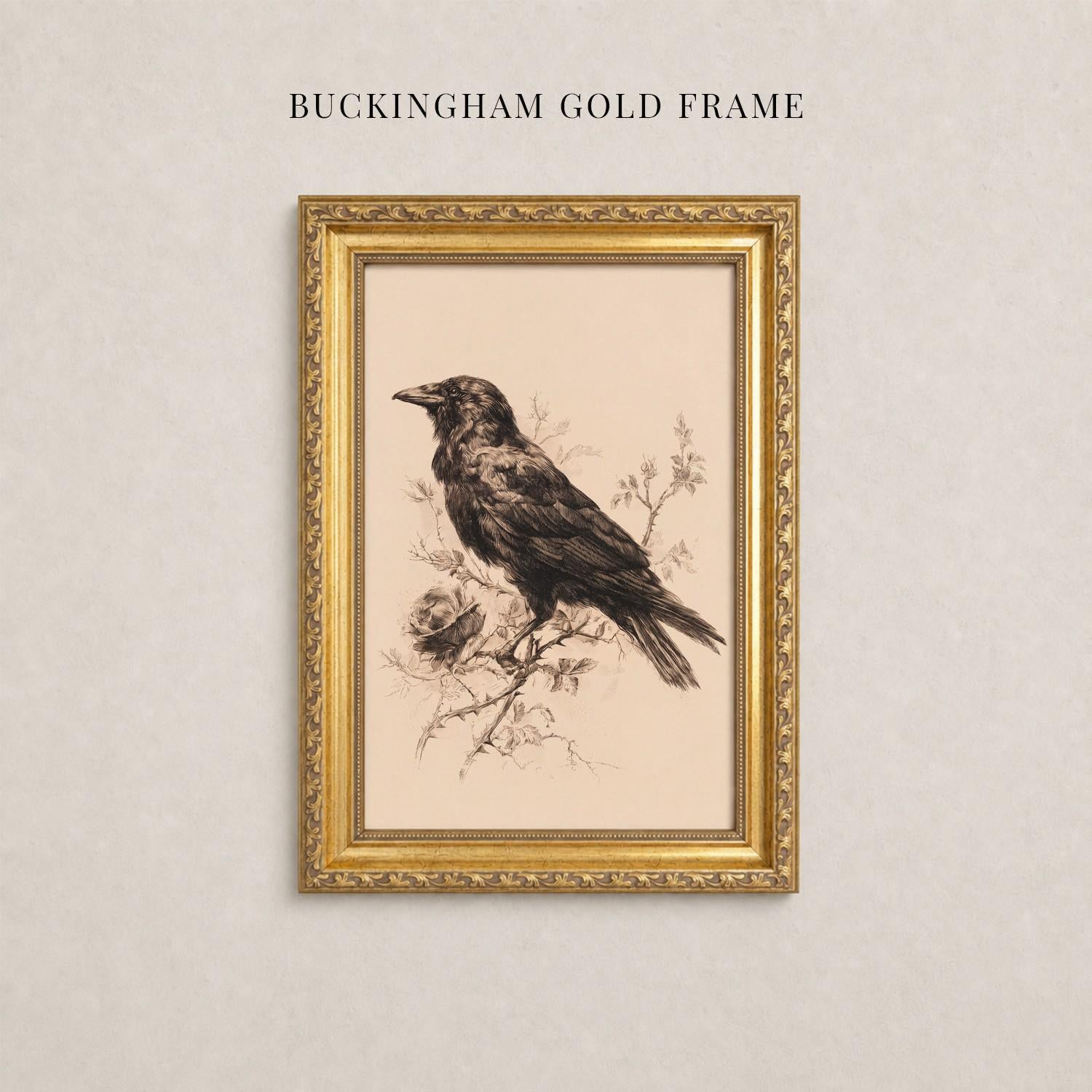 A framed illustration of a black bird perched on a branch, with a gold frame.