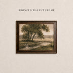 The image is a framed painting of a serene landscape with a tree and a stream, hanging on a wall.