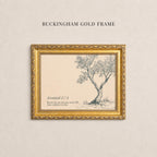 a gold-framed picture of a tree with a caption below it.