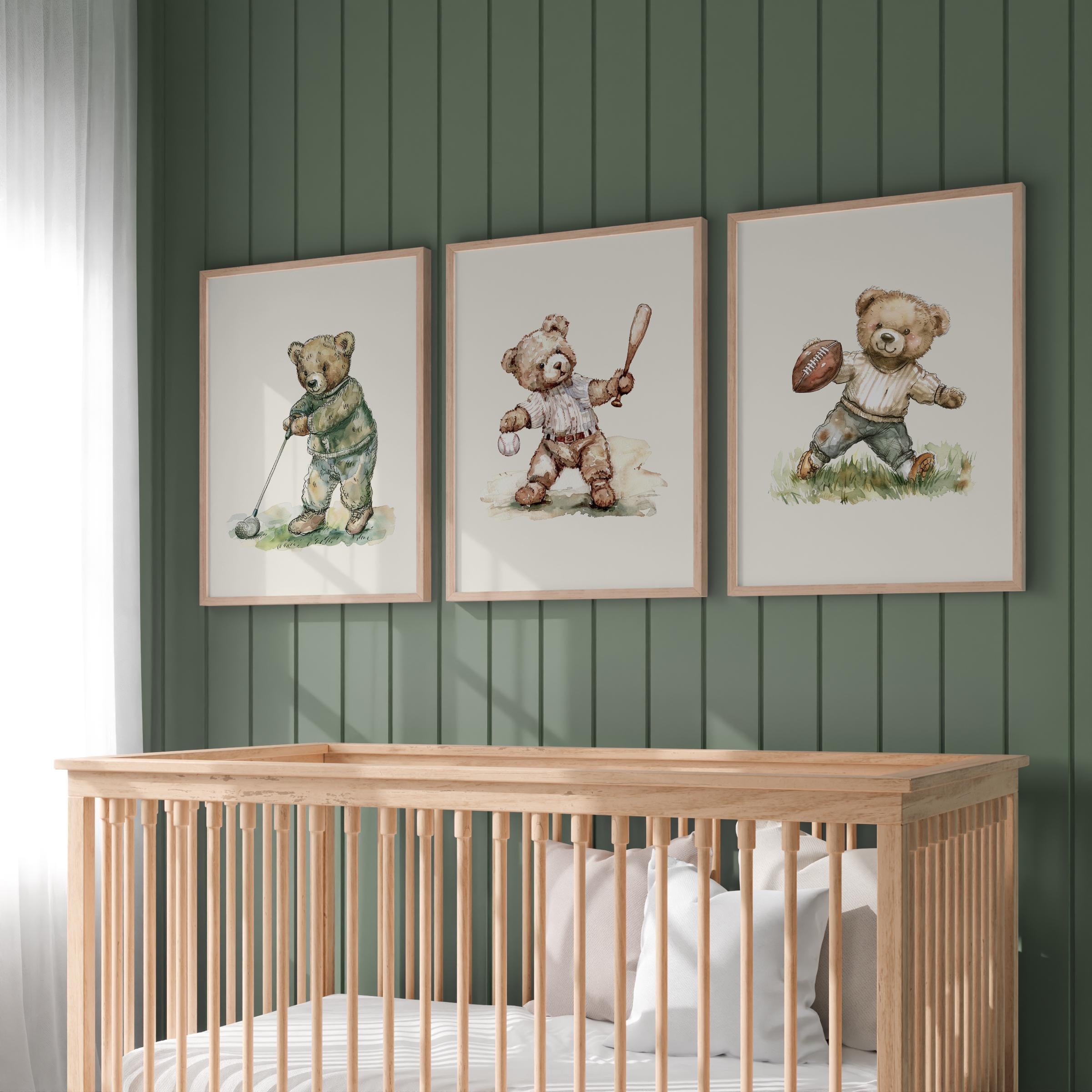 a nursery with a wooden crib and three framed pictures of teddy bears on the wall above it.