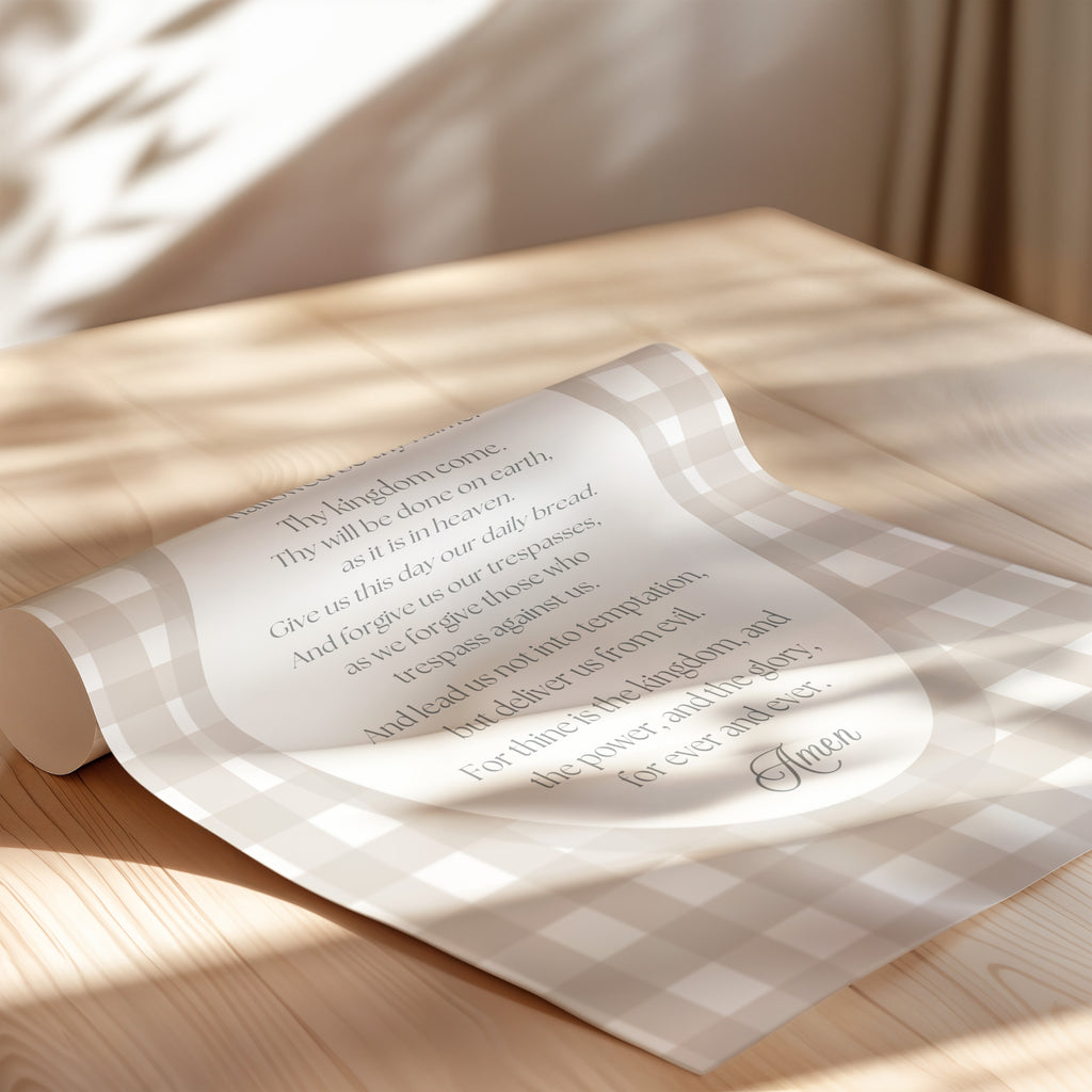 a rolled-up paper with text on it, resting on a wooden surface.