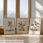 three framed watercolor paintings of teddy bears, each depicting a different activity - playing golf, holding a baseball bat, and holding a football.