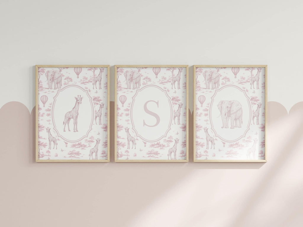 three framed pictures of giraffes and elephants, each with a unique design and color scheme.