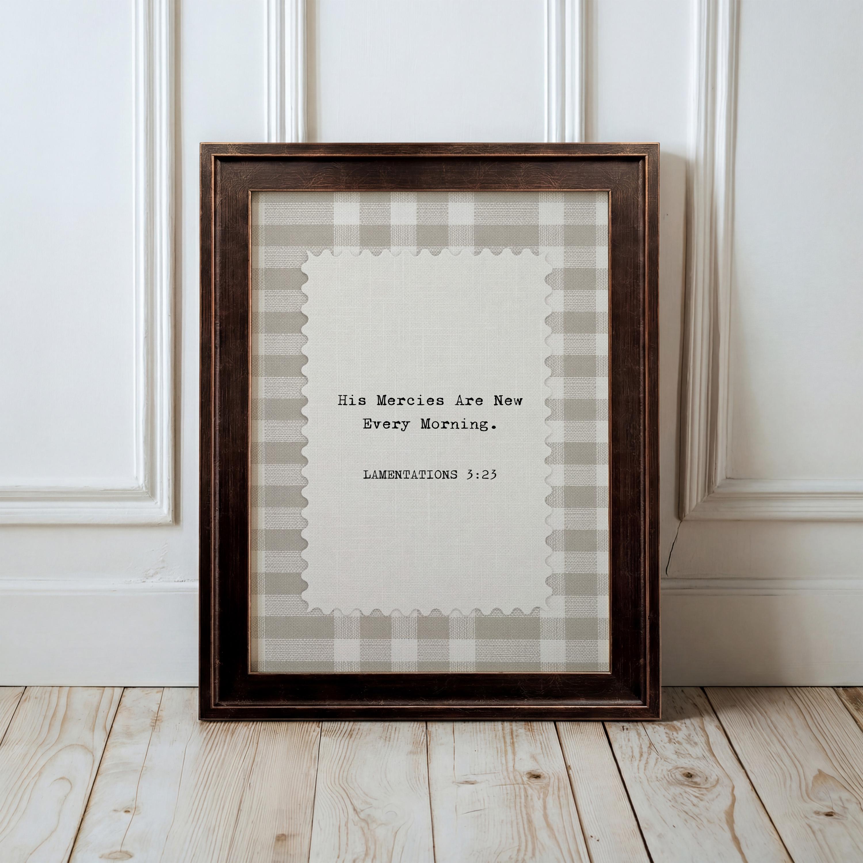 a wooden frame with a white and gray plaid border, and inside the frame is a black and white photograph of a person. The text on the frame reads "His mercies are now Every morning."