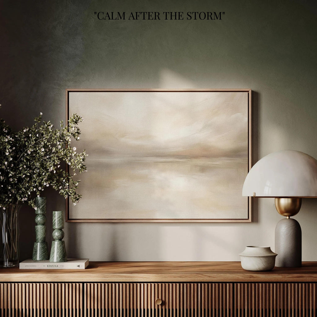 a wooden shelf with a framed landscape painting, a lamp, and a vase of flowers. The painting is titled "Calm after the Storm".