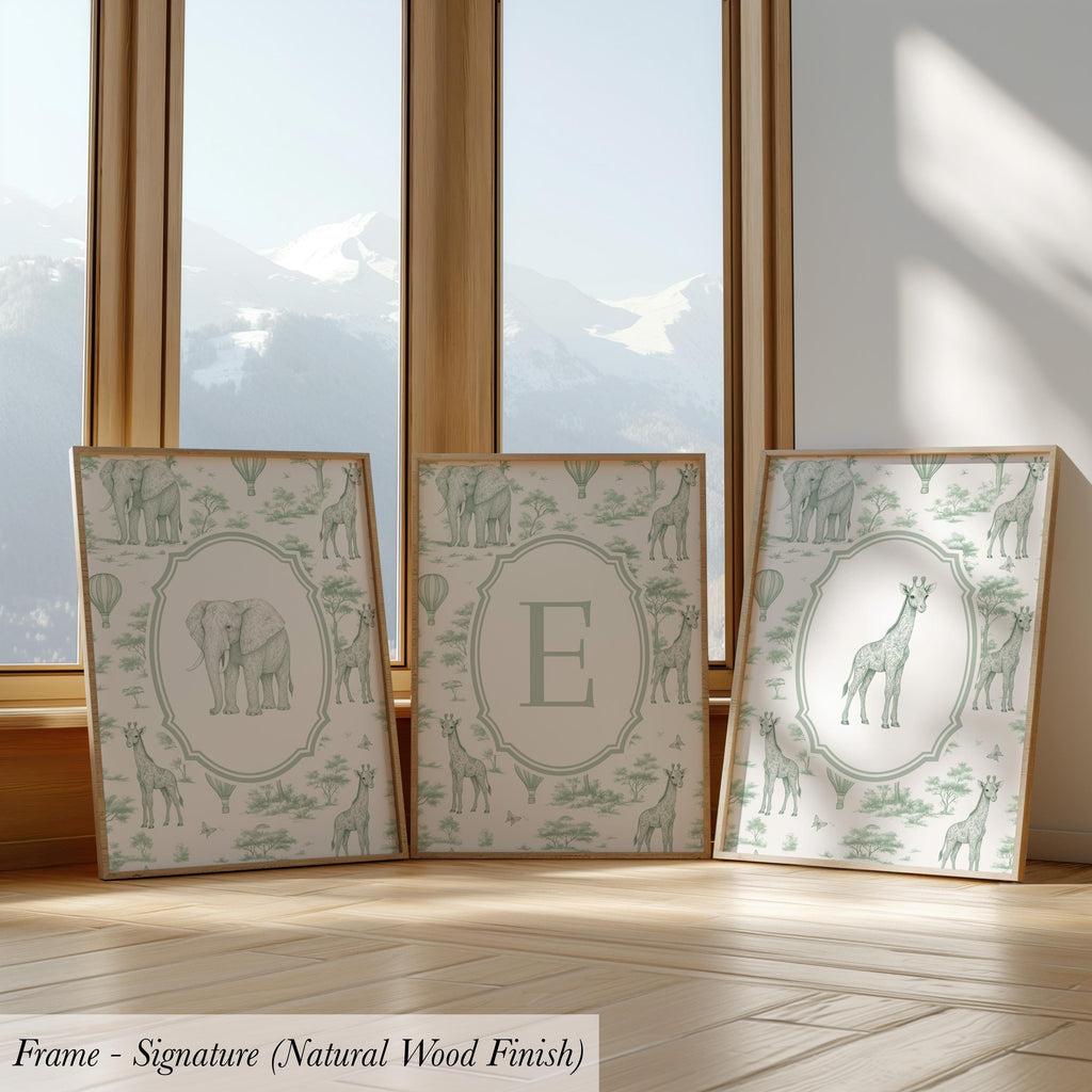 three framed artworks depicting various animals, including elephants, giraffes, and zebras, arranged in a row on a wooden floor.