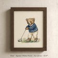 A framed watercolor painting of a teddy bear dressed in a blue sweater and holding a golf club, standing on a grassy surface.