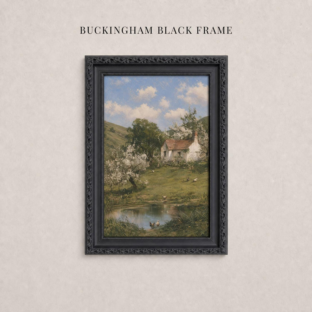A framed painting depicting a rural landscape with a pond, trees, and a house in the background.