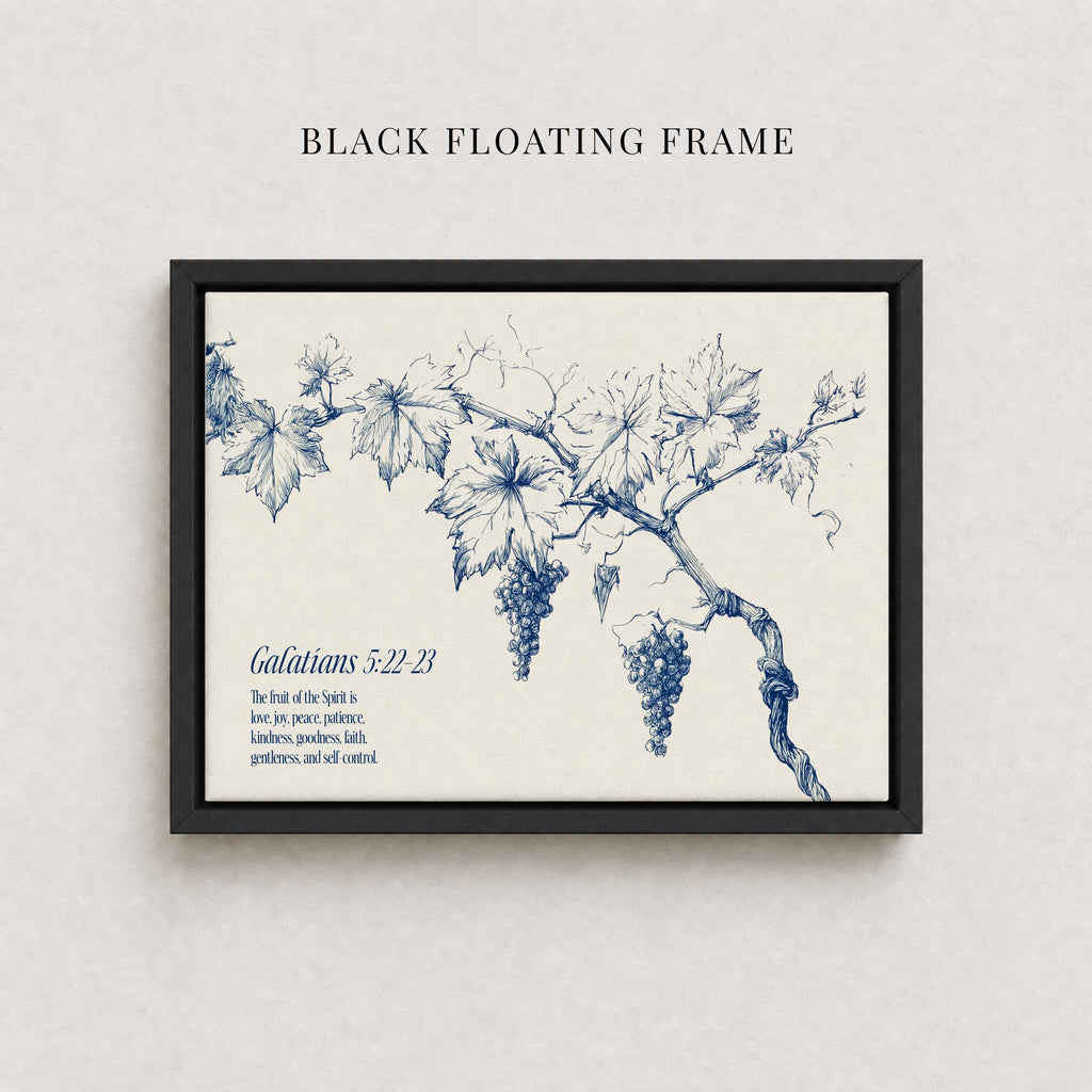 The image is a framed print featuring a blue and white illustration of a grape vine with grapes hanging from it. The text below the illustration reads "Galatians 5:22-23" and provides a biblical verse from the book of Galatians.