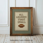 A framed cross-stitch design with the text "ALL LEGENDS START SMALL" and a football image.