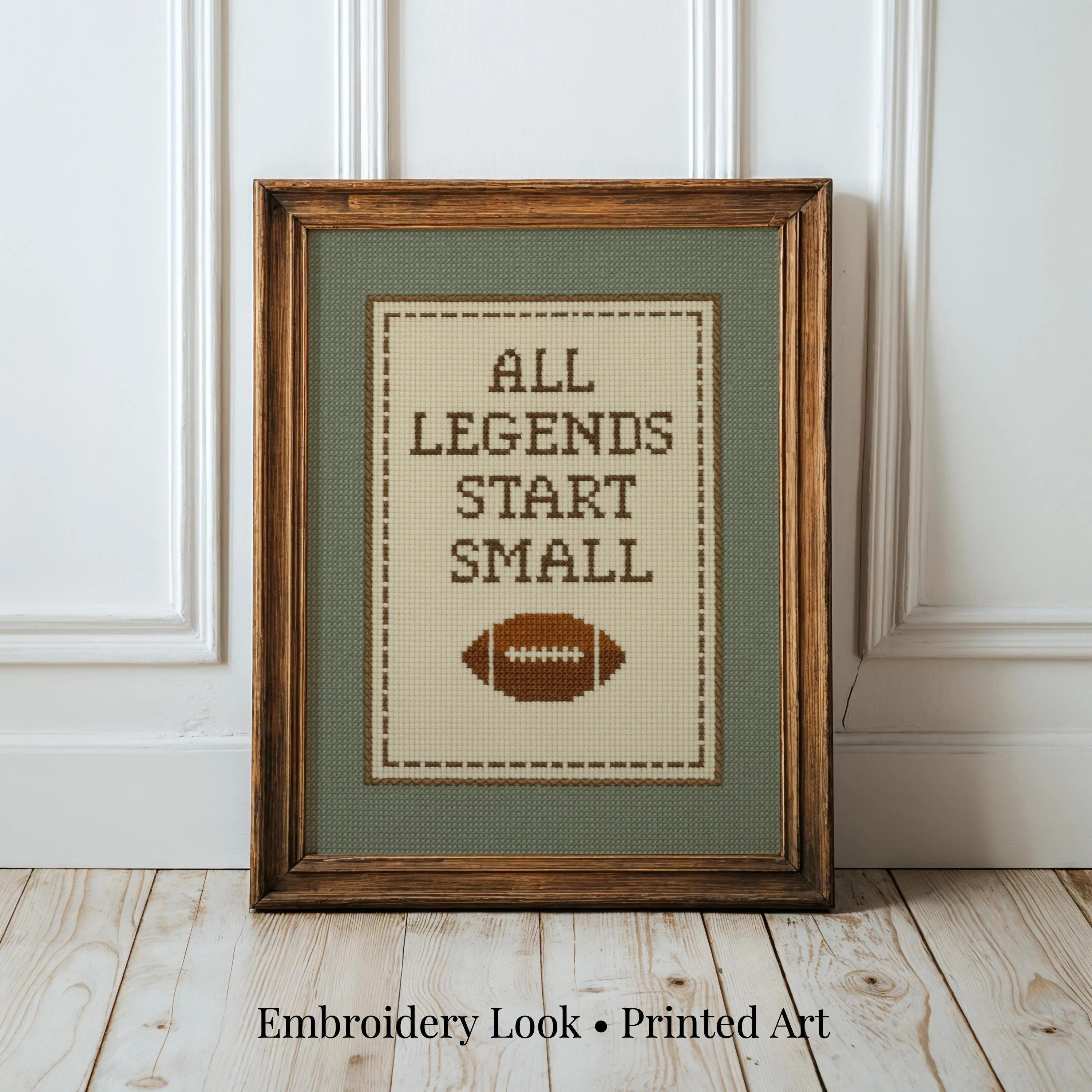 A framed cross-stitch design with the text "ALL LEGENDS START SMALL" and a football image.