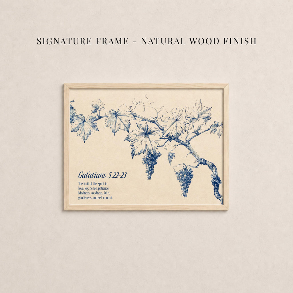 The image is a framed print featuring a blue illustration of grapes and leaves on a branch.