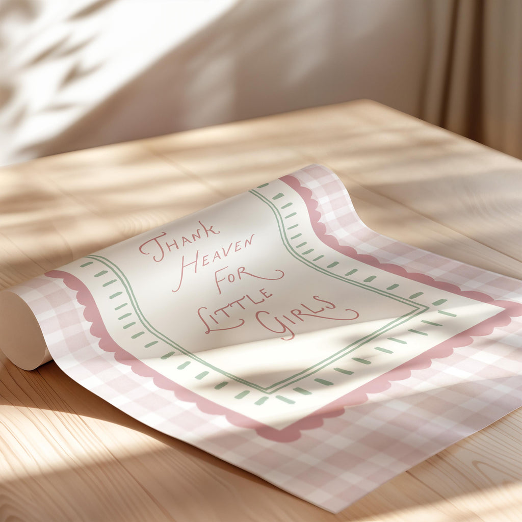 a rolled-up paper with a message written on it, placed on a wooden surface.