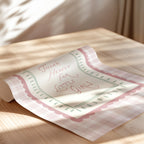 a rolled-up paper with a message written on it, placed on a wooden surface.