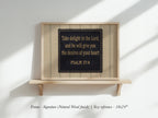 a framed Bible verse from Psalm 37:4, which reads "Take delight in the Lord, and he will give you the desires of your heart". The frame is made of natural wood finish, and the size reference provided is "18.3 x 24".