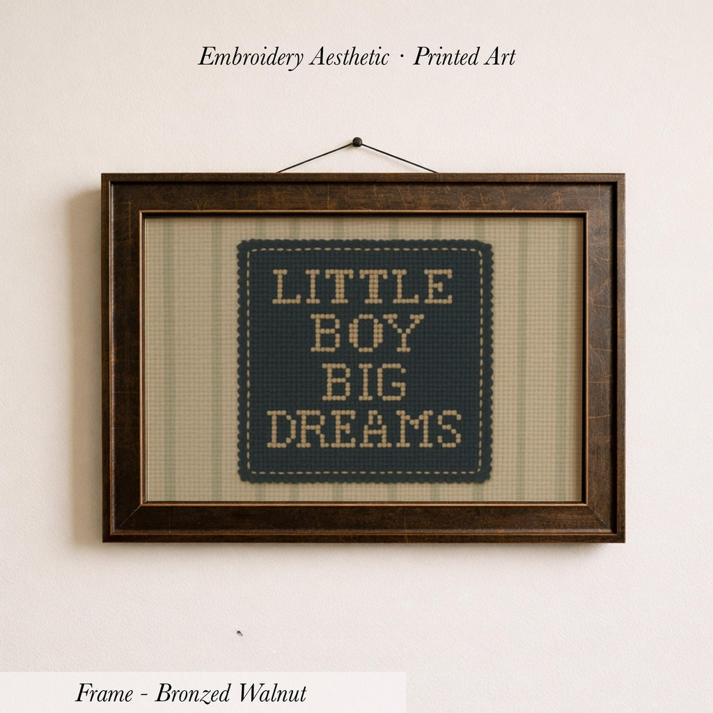 a framed embroidered piece of art with the text "LITTLE BOY BIG DREAMS" on it.