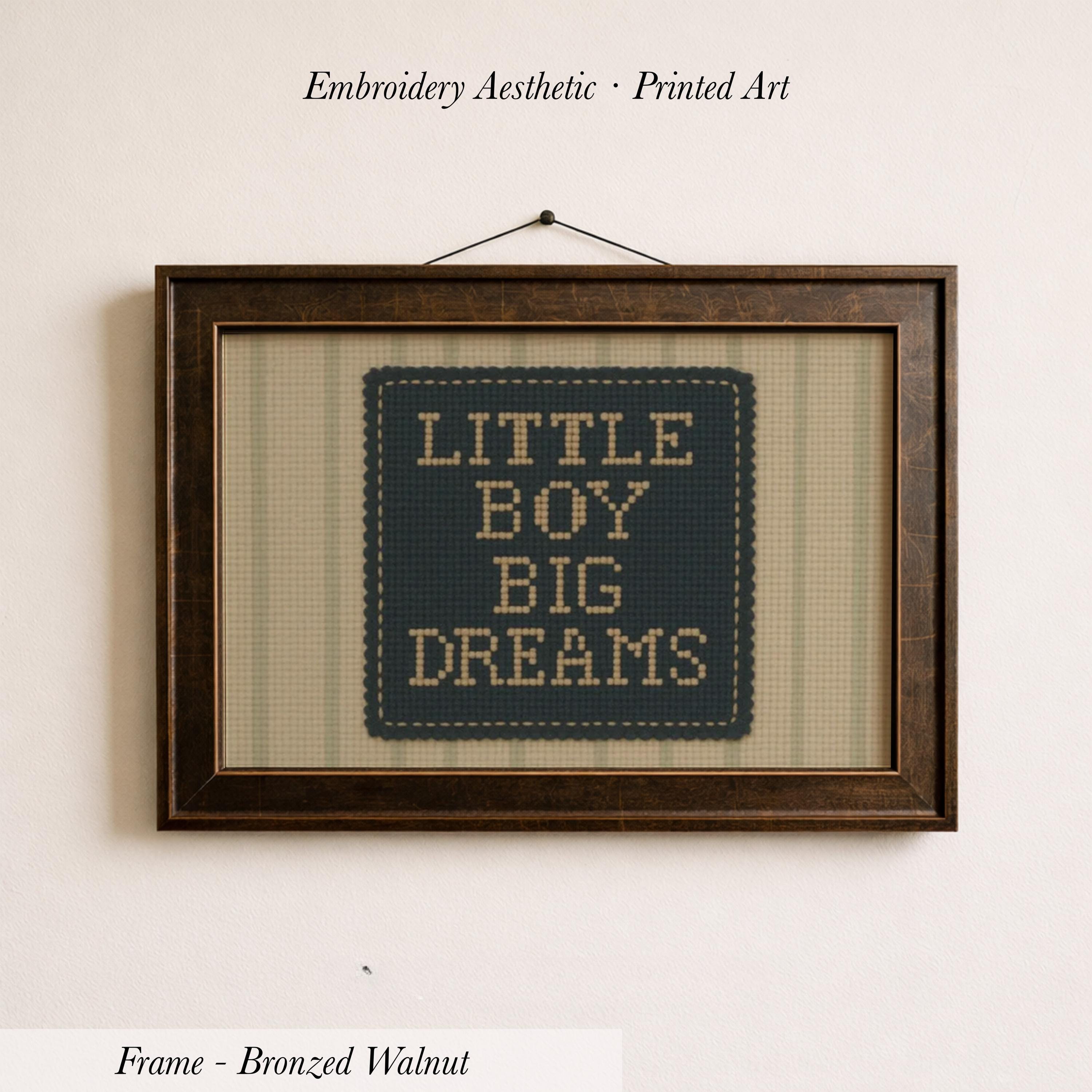 a framed embroidered piece of art with the text "LITTLE BOY BIG DREAMS" on it.