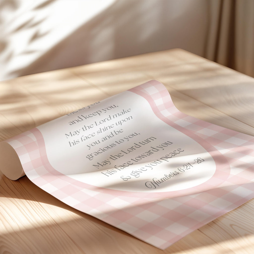 a rolled-up piece of paper with text on it, resting on a wooden surface.