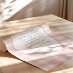 a rolled-up piece of paper with text on it, resting on a wooden surface.