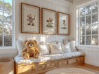A cozy and inviting room with a plush white sofa, a teddy bear, and three framed pictures of teddy bears on the wall.