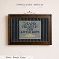 a framed embroidered piece of art with the text "THANK HEAVEN FOR LITTLE BOYS" on it.