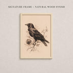 a framed illustration of a bird perched on a branch, with a natural wood finish.