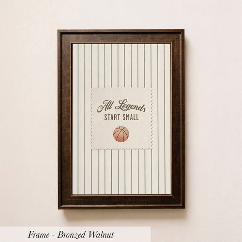 A framed picture with a basketball and the text "All Legends Start Small" on it, hanging on a wall.