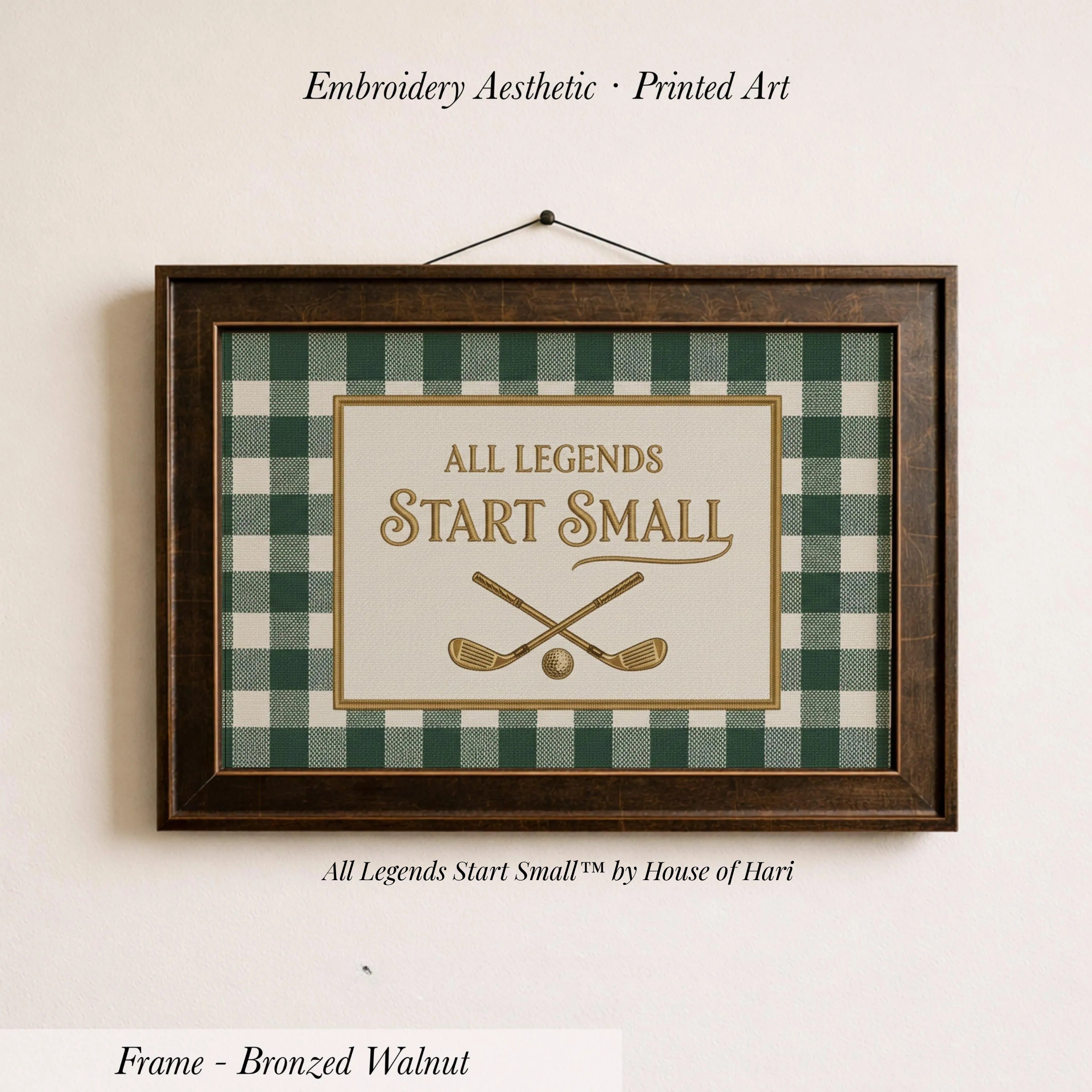 a framed print with the text "ALL LEGENDS START SMALL" and a graphic of a pair of crossed golf clubs.