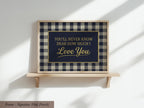 a framed sign with the text "You'll never know how much I love you" against a blue and white checkered background.