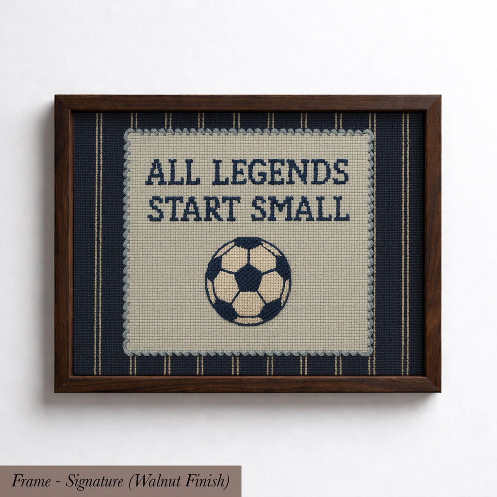 The image is a framed embroidery with the text "ALL LEGENDS START SMALL" and a soccer ball design.
