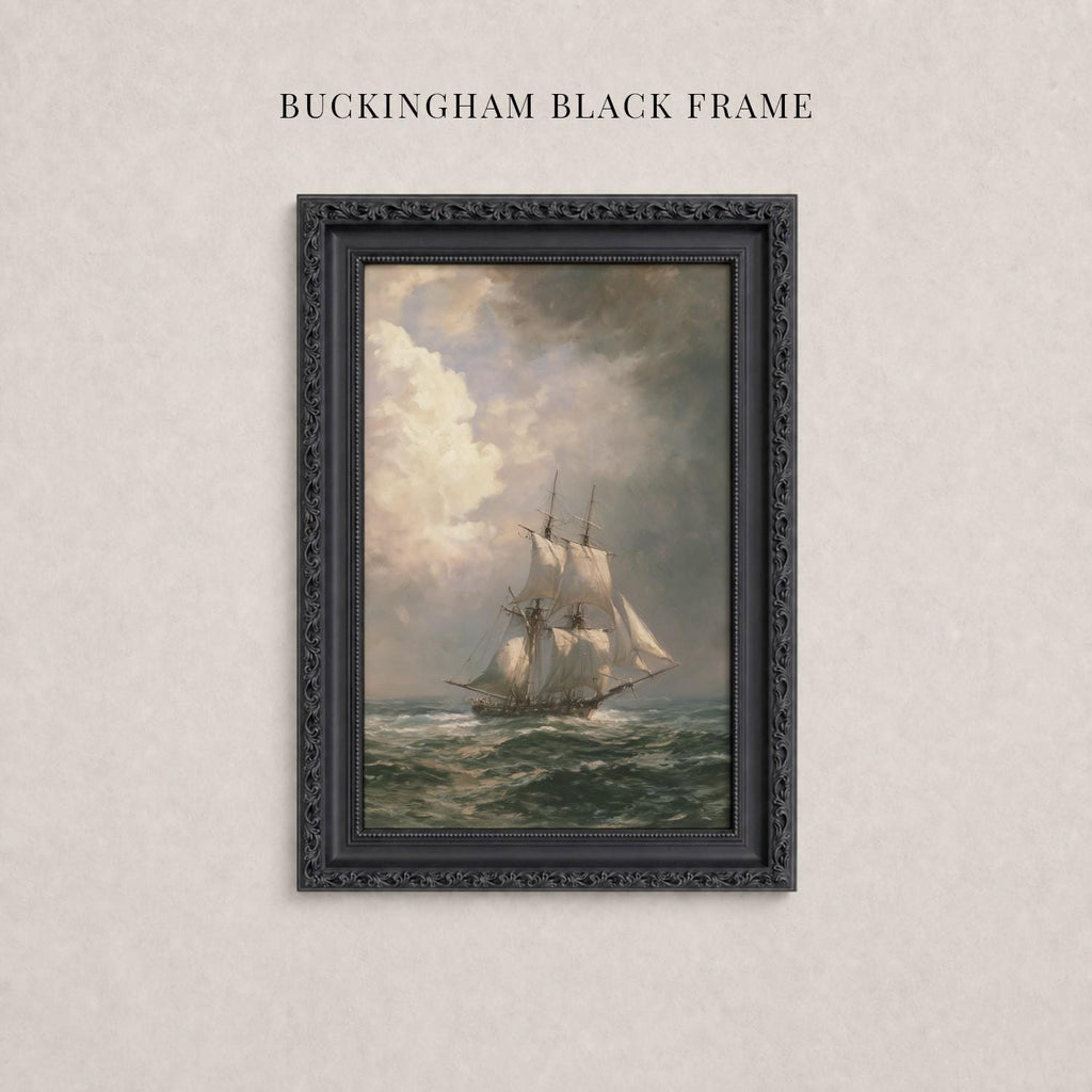 A painting of a sailing ship on the ocean, framed in a black ornate frame.