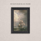 A painting of a sailing ship on the ocean, framed in a black ornate frame.